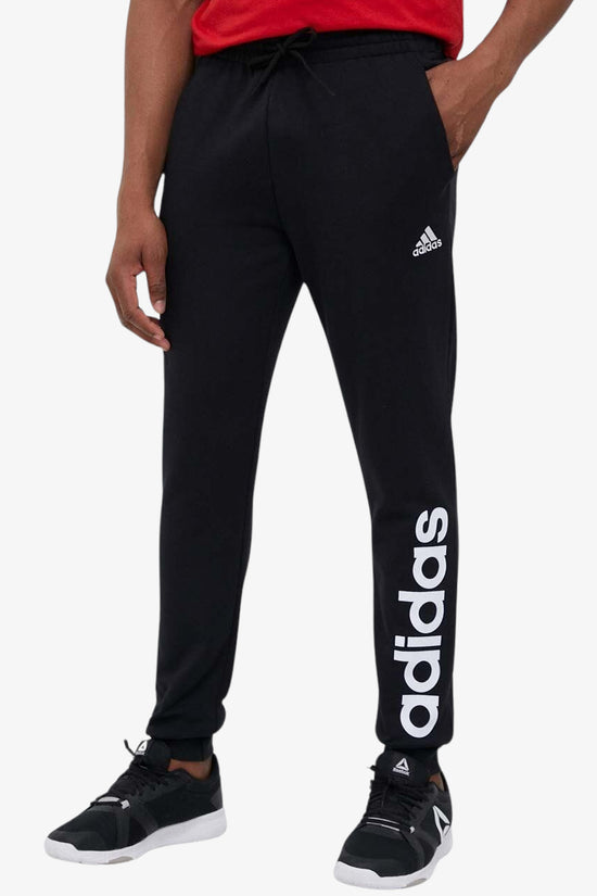Pantaloni Essentials Tapered Cuff Logo-adidas performance-Nero-Uomo-Ic0063-