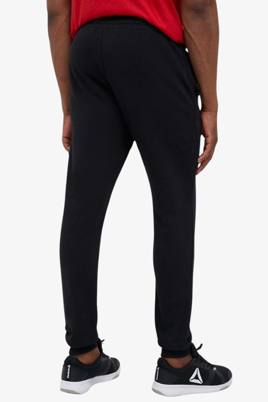 Pantaloni Essentials Tapered Cuff Logo-adidas performance-Nero-Uomo-Ic0063-